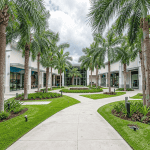 Commercial landscape hurricane preparation at a modern outdoor shopping center in South Florida