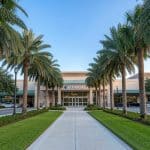 Commercial plaza in Palm Beach County with best commercial landscaping and tropical plants around storefronts